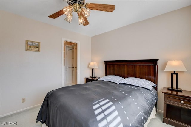 bedroom with a ceiling fan, light carpet, and baseboards