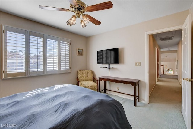 bedroom featuring visible vents, ceiling fan, light carpet, and baseboards