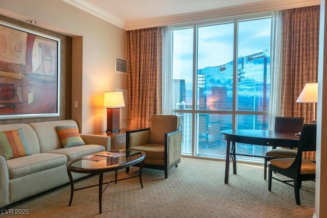 sitting room featuring a view of city, visible vents, and crown molding