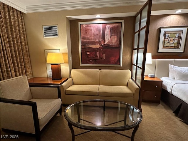 living area featuring visible vents and crown molding