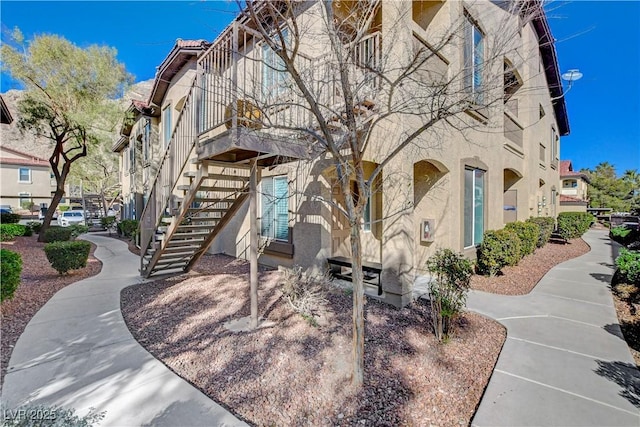 view of property featuring stairs