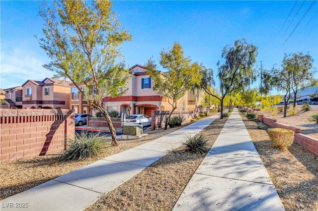 surrounding community with a residential view and fence