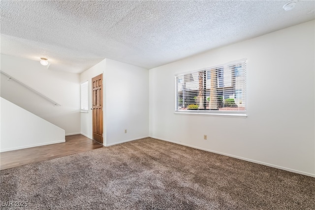 2667 Aracatuba Ave, Las Vegas, NV 89121 - empty room featuring carpet flooring, a textured ceiling, and baseboards