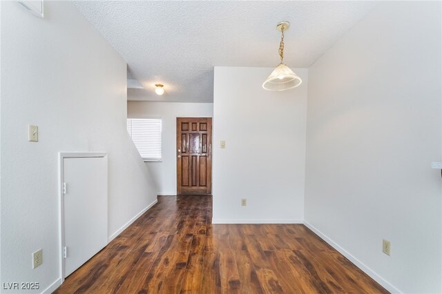 2667 Aracatuba Ave, Las Vegas, NV 89121 - unfurnished room with a textured ceiling, baseboards, and wood finished floors