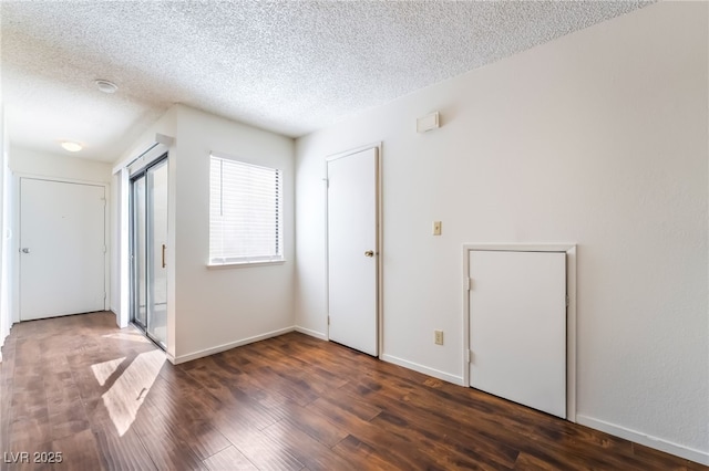 2667 Aracatuba Ave, Las Vegas, NV 89121 - empty room featuring baseboards, a textured ceiling, and wood finished floors