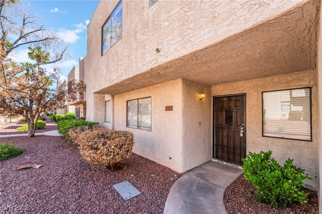 2667 Aracatuba Ave, Las Vegas, NV 89121 - entrance to property with stucco siding