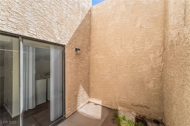 2667 Aracatuba Ave, Las Vegas, NV 89121 - exterior space with washing machine and clothes dryer and stucco siding