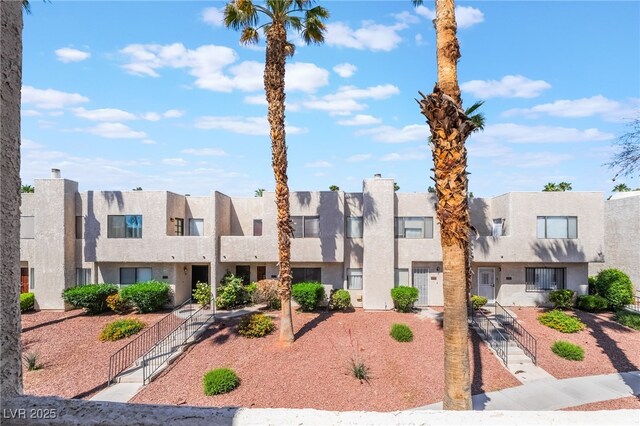 2667 Aracatuba Ave, Las Vegas, NV 89121 - view of front of home featuring a gate, stucco siding, a residential view, and fence