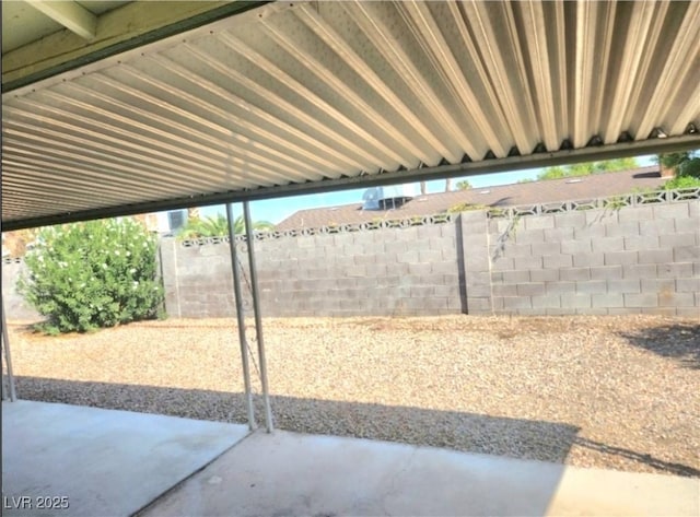 view of patio / terrace featuring fence