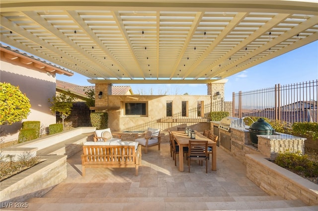 view of patio / terrace featuring grilling area, an outdoor living space, exterior kitchen, and fence