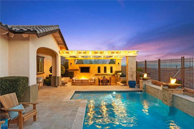 pool at dusk featuring a patio, a fenced in pool, fence, a fireplace, and a pergola