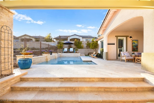 view of pool featuring a fenced backyard and a patio area