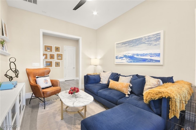 living area with recessed lighting, baseboards, ceiling fan, and light wood finished floors