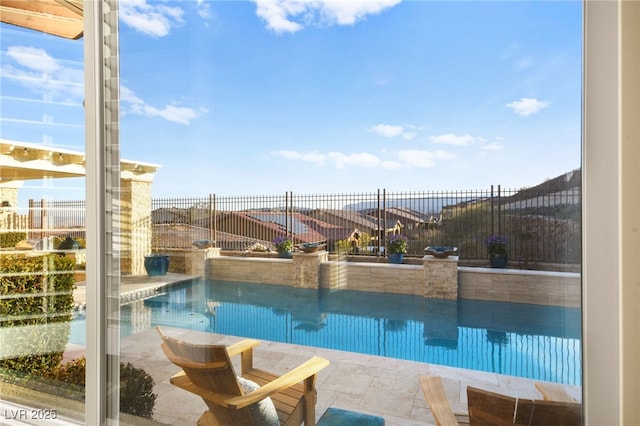 view of swimming pool featuring fence and a fenced in pool