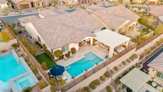 birds eye view of property with a residential view