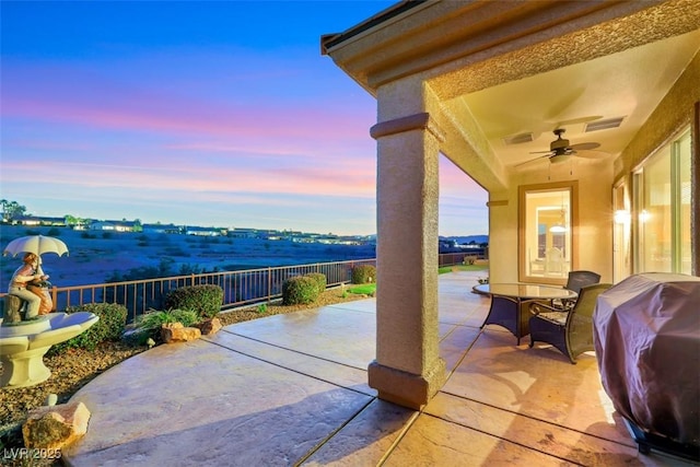 view of patio featuring area for grilling, fence, visible vents, and ceiling fan