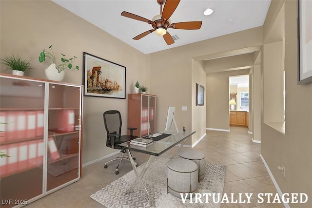 office with light tile patterned floors, visible vents, baseboards, and ceiling fan