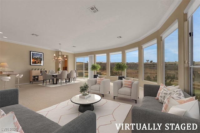 living area with crown molding, carpet flooring, visible vents, and a chandelier