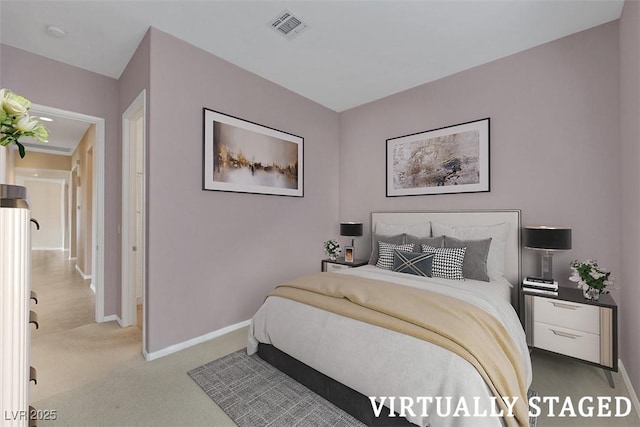 bedroom featuring visible vents, light carpet, and baseboards