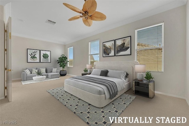 bedroom with crown molding, carpet flooring, baseboards, and visible vents