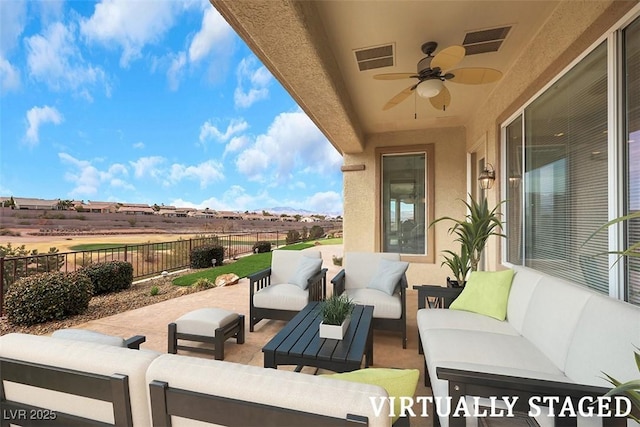 view of patio featuring visible vents, outdoor lounge area, ceiling fan, and fence