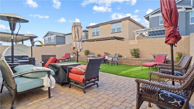 view of patio / terrace featuring a fenced backyard and an outdoor living space