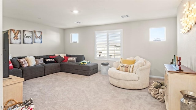 living area featuring carpet and visible vents