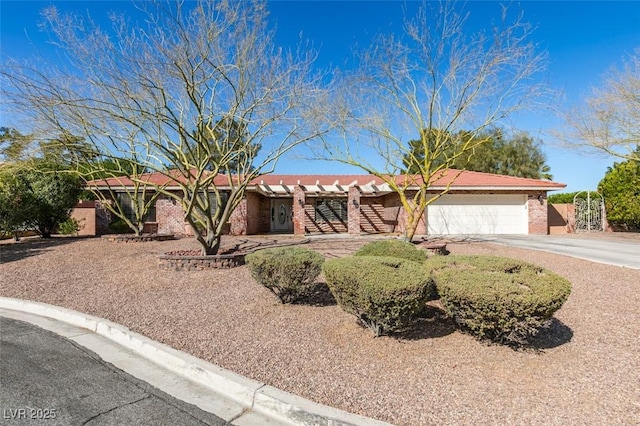 ranch-style house featuring driveway, a garage, and brick siding