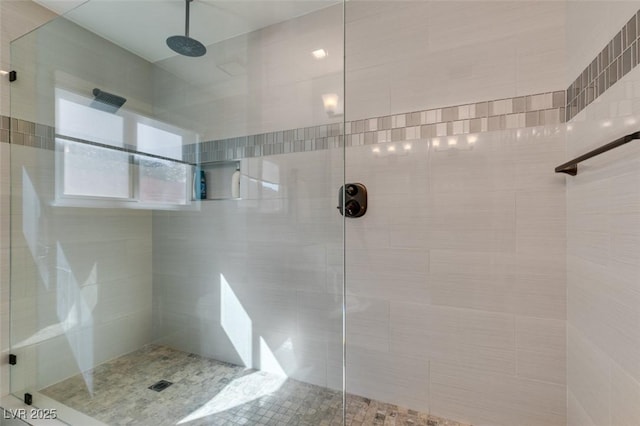 full bath featuring a tile shower