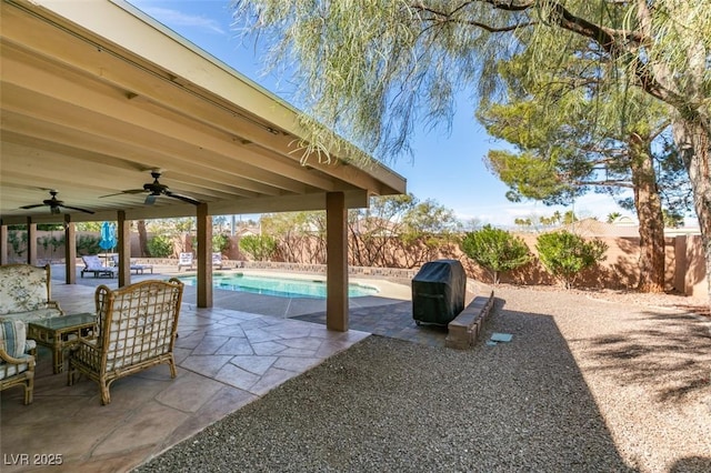 view of patio / terrace with ceiling fan, a fenced backyard, a fenced in pool, and a grill