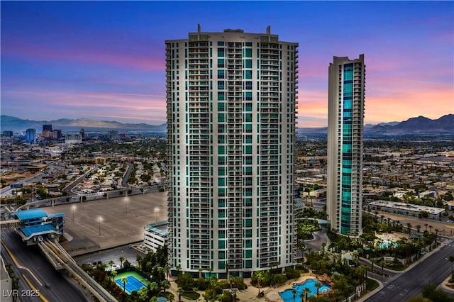 view of property with a view of city and a mountain view