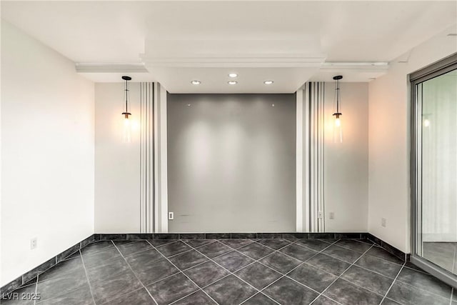 spare room featuring dark tile patterned floors, recessed lighting, and baseboards