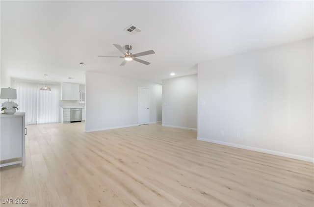 unfurnished living room featuring light wood finished floors, recessed lighting, visible vents, ceiling fan, and baseboards