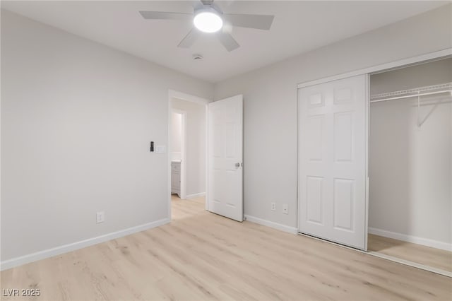 unfurnished bedroom featuring light wood finished floors, ceiling fan, baseboards, and a closet