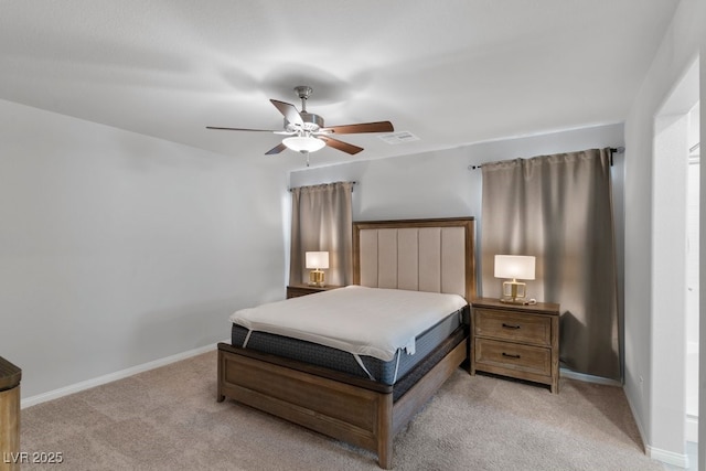 bedroom featuring light colored carpet, visible vents, and baseboards