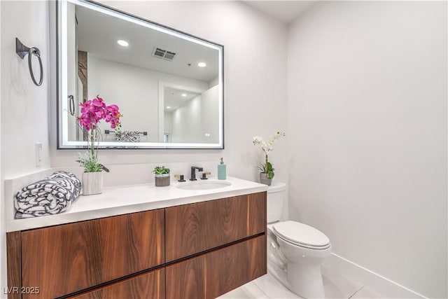 bathroom with recessed lighting, visible vents, toilet, vanity, and tile patterned floors