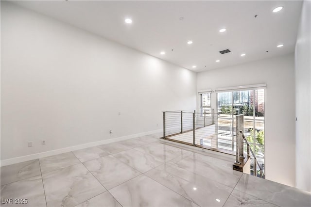 unfurnished room with recessed lighting, visible vents, and baseboards