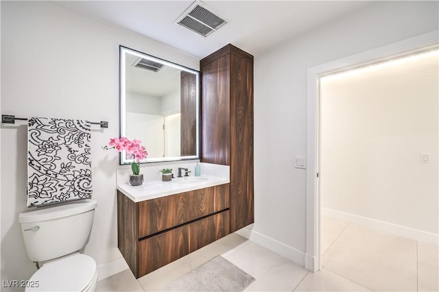 bathroom featuring toilet, tile patterned flooring, visible vents, and vanity