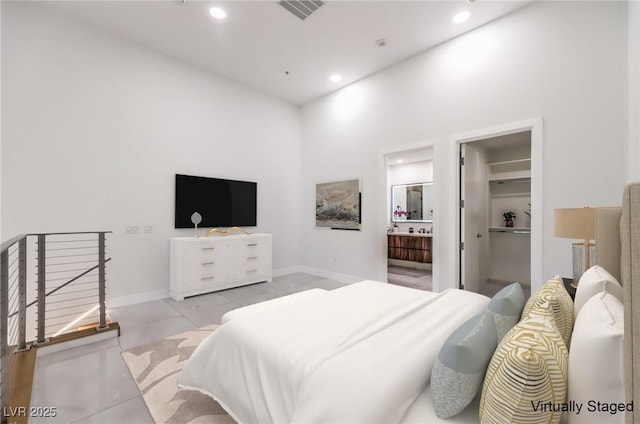 bedroom featuring recessed lighting, visible vents, a spacious closet, and baseboards