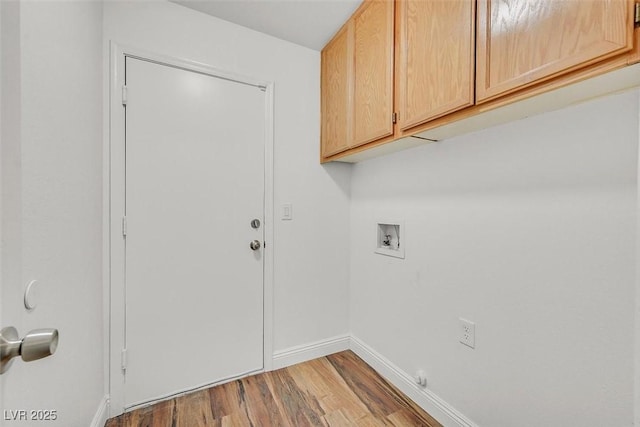 laundry room with washer hookup, wood finished floors, cabinet space, and baseboards