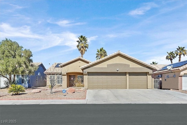 view of front of property with concrete driveway, an attached garage, and stucco siding