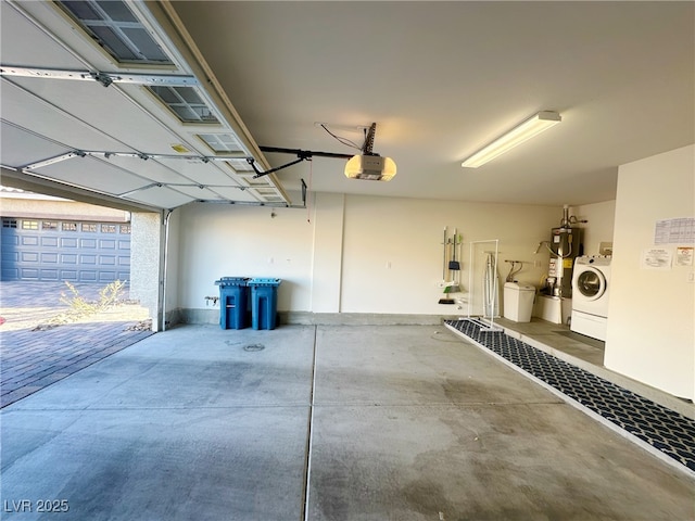 garage with washer / dryer and a garage door opener