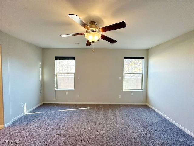 unfurnished room with a ceiling fan, baseboards, a wealth of natural light, and carpet flooring