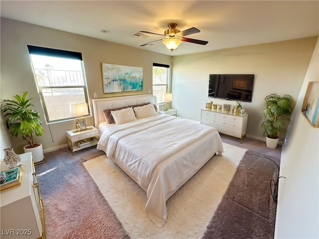 bedroom featuring a ceiling fan, carpet, visible vents, and baseboards