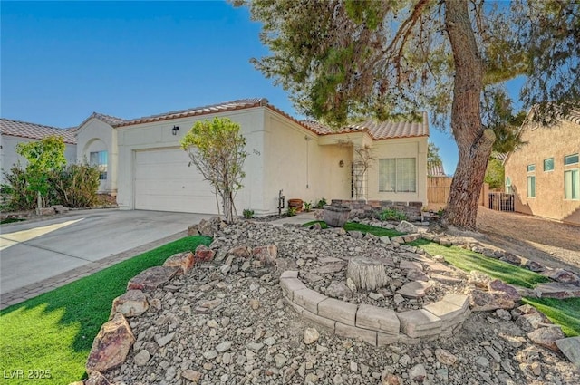 mediterranean / spanish-style house with a tile roof, stucco siding, concrete driveway, fence, and a garage