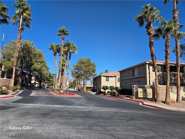 view of road featuring curbs and a residential view