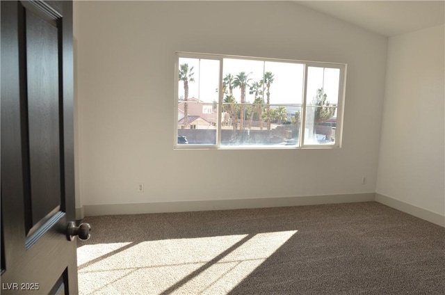 carpeted empty room with plenty of natural light and baseboards