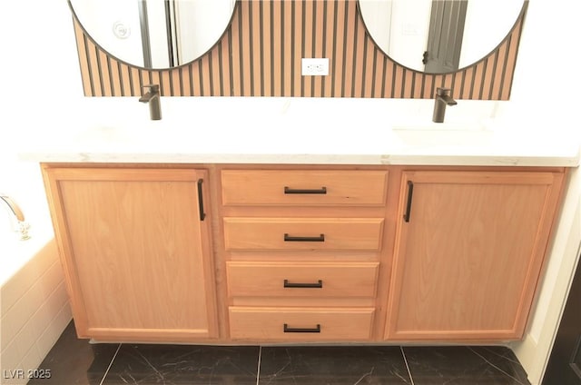 full bathroom with marble finish floor, vanity, and wallpapered walls