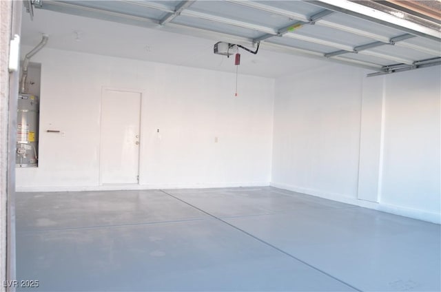 garage with strapped water heater and a garage door opener