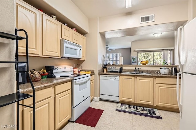 8000 W Badura Ave Unit 1019, Las Vegas, NV 89113 - kitchen featuring white appliances, light brown cabinetry, and a ceiling fan